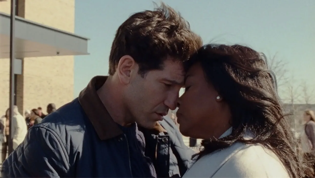 Ava DuVernay's Origin film still: Man and woman face each other, foreheads touching.