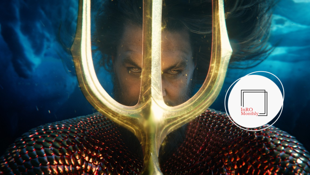 Aquaman underwater, holding trident. Jason Momoa as DC Comics superhero. Movie promotion.