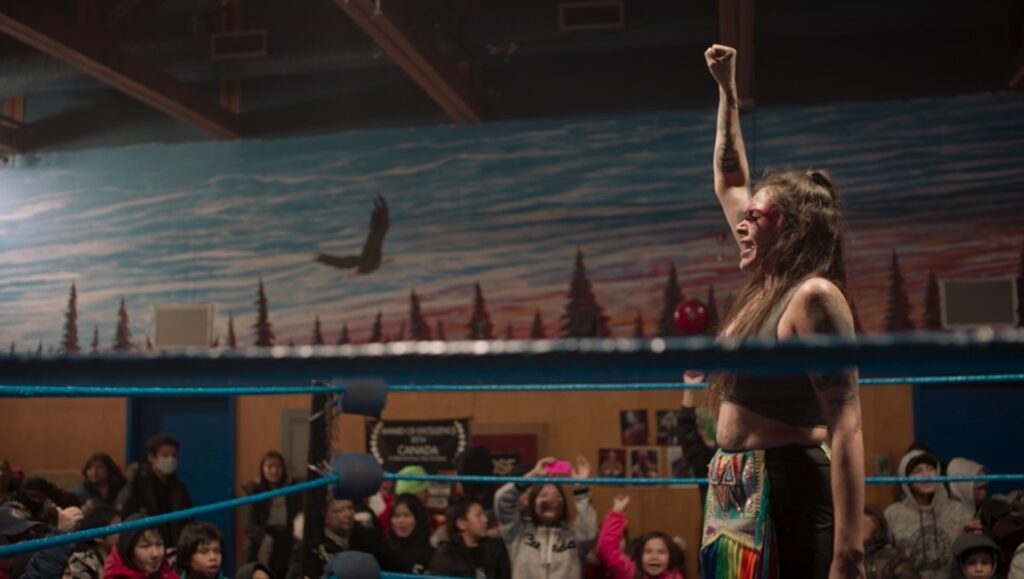 The Death Tour at Slamdance Film Festival 2024: Wrestler celebrates victory in the ring. Audience cheers.