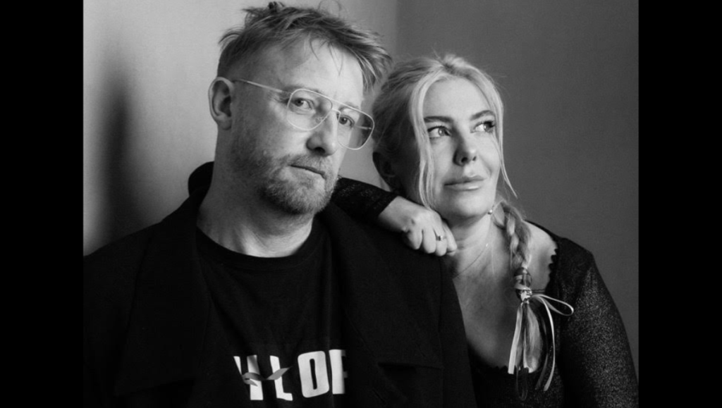 Black and white portrait of Hugh Welchman, film director, with his wife.