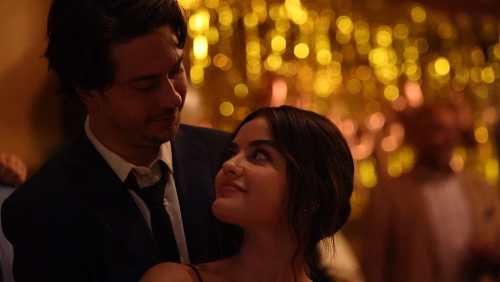 Which Brings Me to You movie still. Lucy Hale and Nat Wolff in a romantic embrace.
