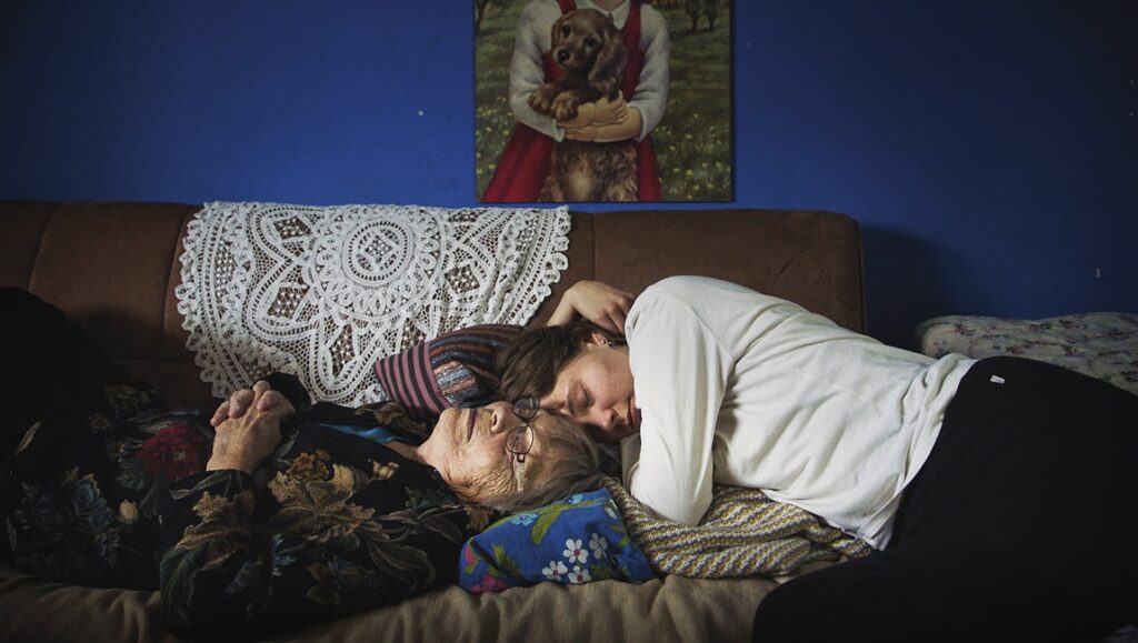 Once Upon a Time in a Forest film review: Three women lie on a couch. A painting of a girl with a dog hangs above.