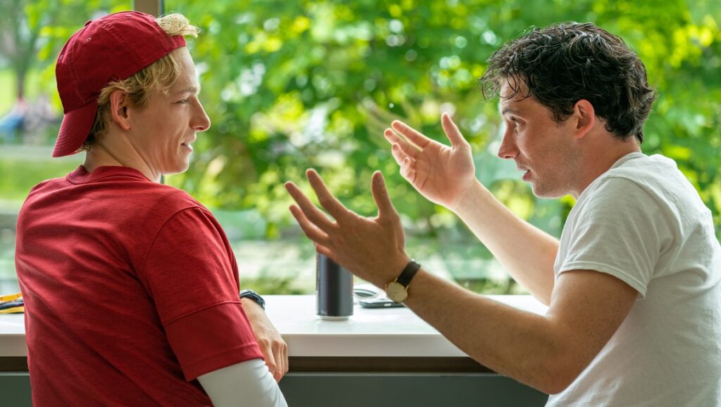 Challengers movie scene: Two men in a tense discussion. Luca Guadagnino film review.