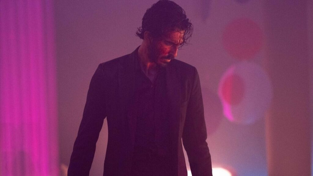 Dev Patel in Monkey Man movie. Dark, gritty action film.