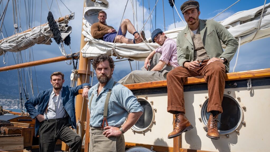 The Ministry of Ungentlemanly Warfare cast on a boat. Henry Cavill stars in Guy Ritchie's WWII film.