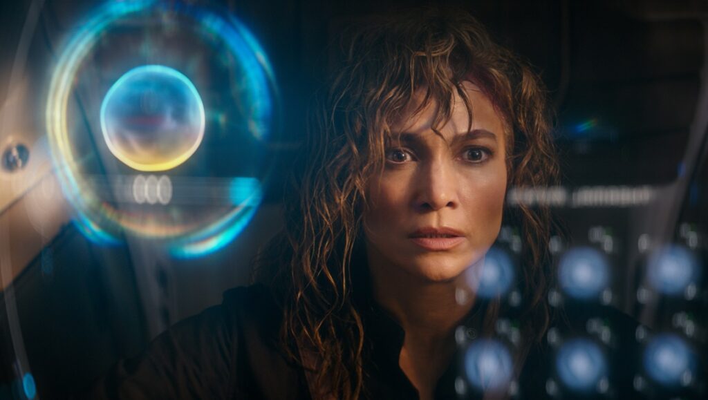 Jennifer Lopez in Atlas movie. Actress with worried expression, futuristic interface.