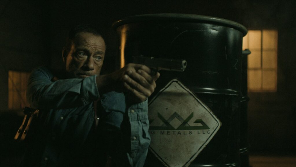 Darkness of Man movie scene. Man points gun, barrel behind. James Cullen Bressack film review.