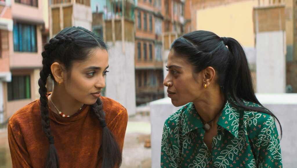 The Shameless movie scene: Two women face each other in a candid moment. Cannes '24 film review.