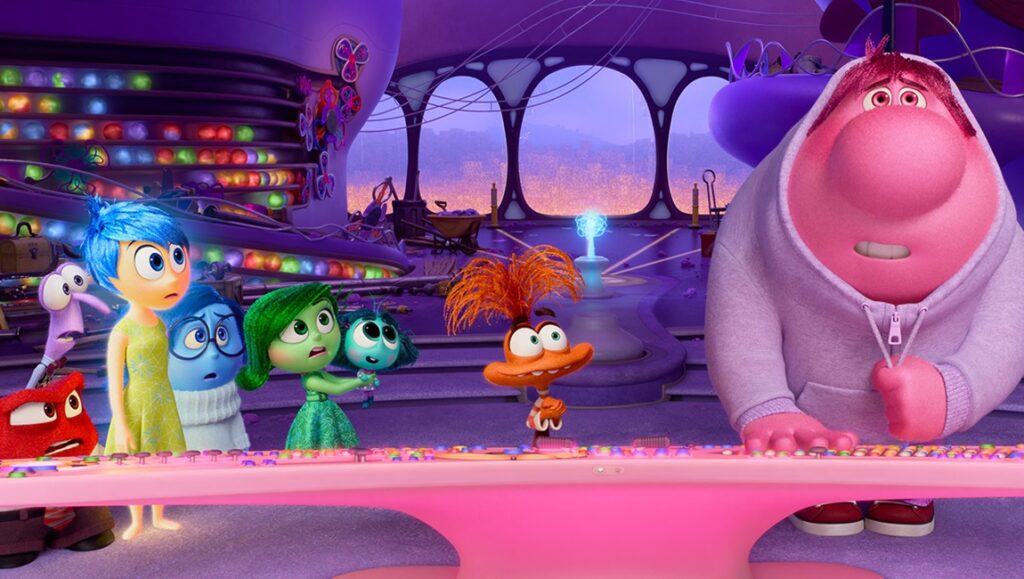 Inside Out 2 movie scene. Joy, Sadness, Anger, Fear, Disgust, Anxiety, Envy, and Embarrassment at the console.