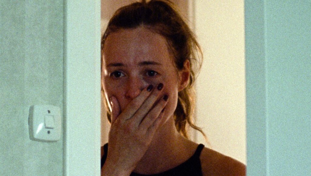 Thea Hvistendahl's Handling the Undead review: Woman with hand over mouth, emotional.