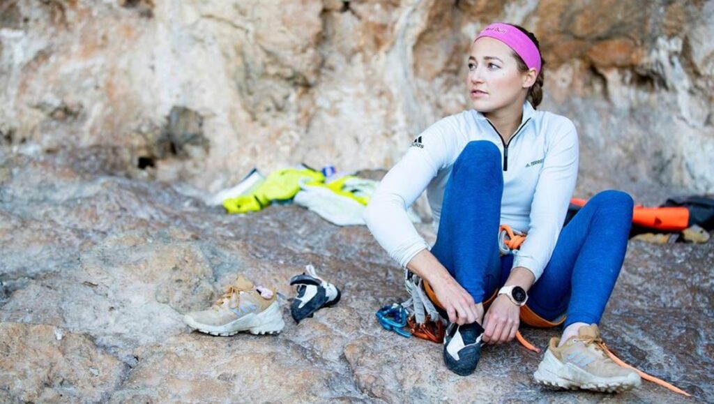 Sasha DiGiulian in Kalymnos, Greece. Female rock climber prepares for climb. Here to Climb movie review.