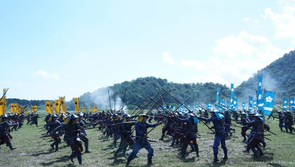 Kubi movie scene: Japanese samurai armies clash on a field with spears and banners. Japan Cuts '24 review.