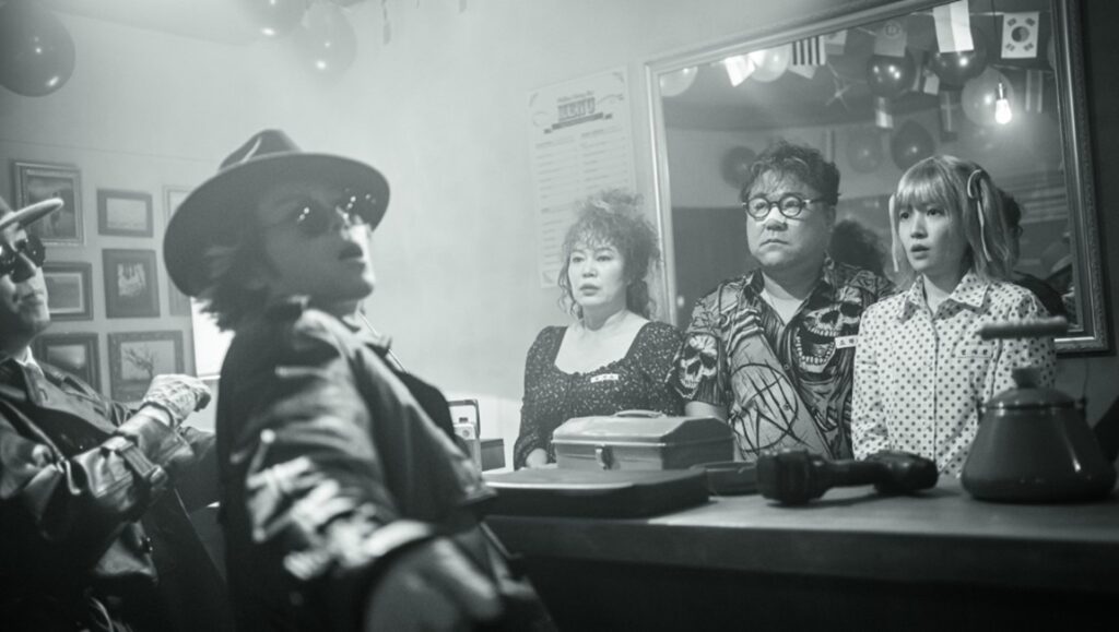 The Killers NYAFF '24 review: Black and white film still of cast members at a bar.