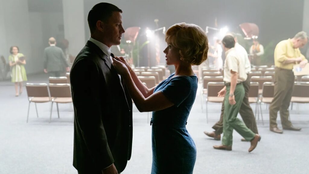 Fly Me to the Moon movie scene. Scarlett Johansson adjusts Channing Tatum's tie. 1960s era.