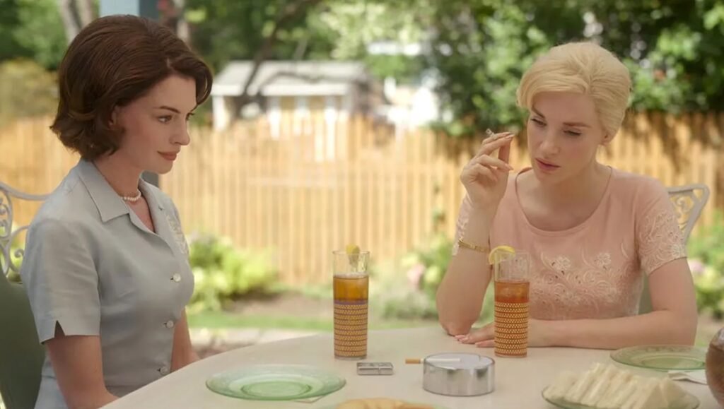 Anne Hathaway and Jessica Chastain in Mothers' Instinct (2024). Two women at a table.