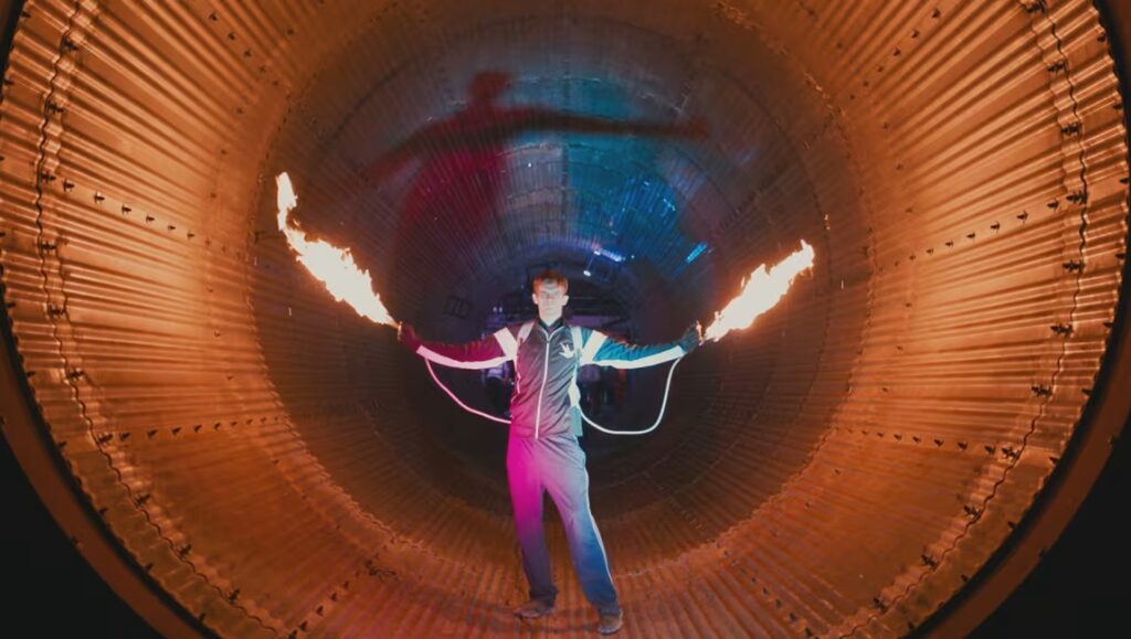 Ross Kauffman's Wild Wild Space review. Man with fire in space suit inside a rocket engine.