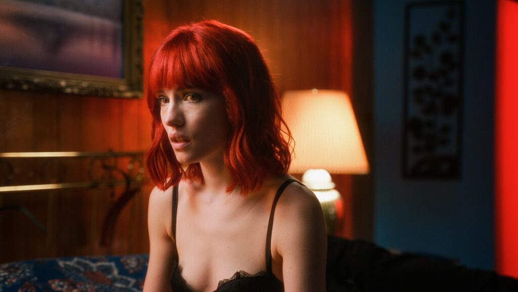 Willa in Strange Darling movie. Woman with red hair and black lingerie. JT Mollner film review.
