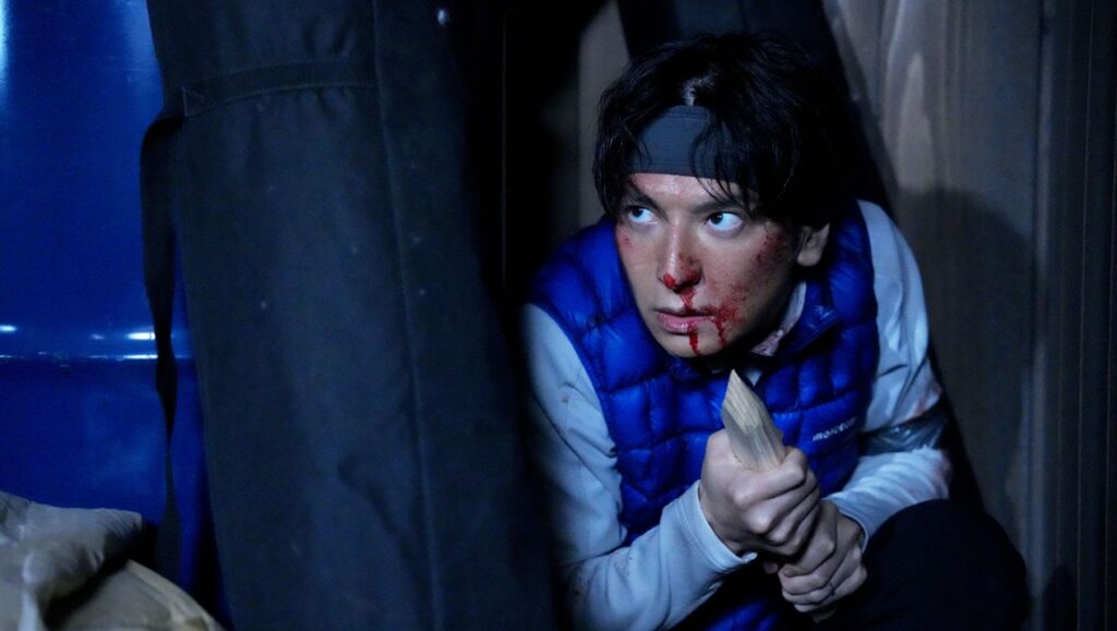 Confession film still from Fantasia Fest. Man with bloodied face holds weapon. Thriller, horror.