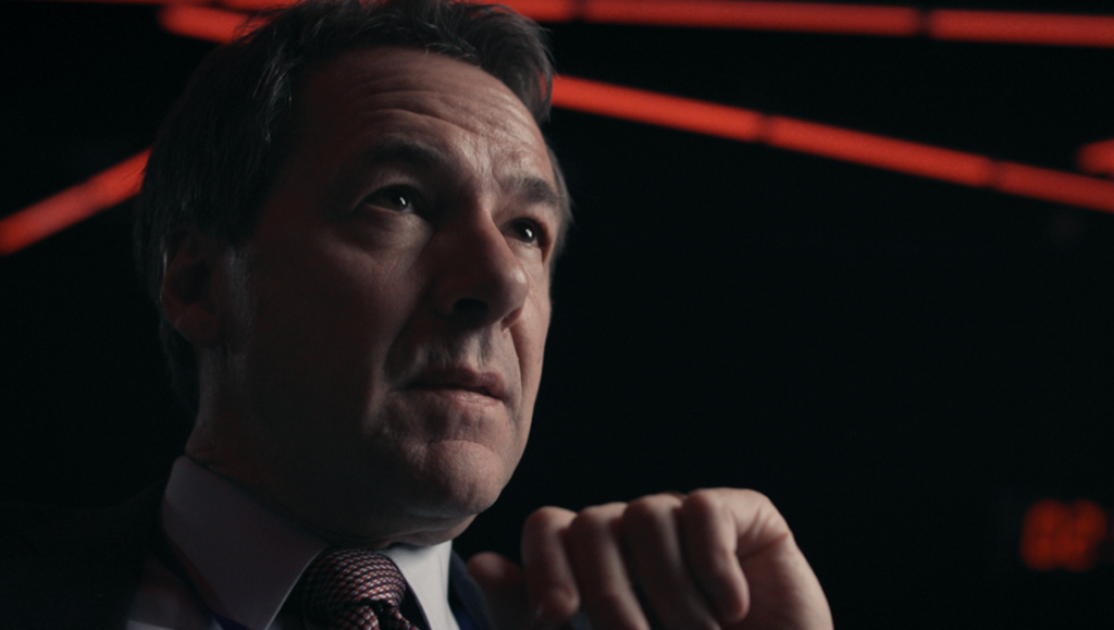 War Game review: Man in suit with red light background. Jesse Moss & Tony Gerber film.