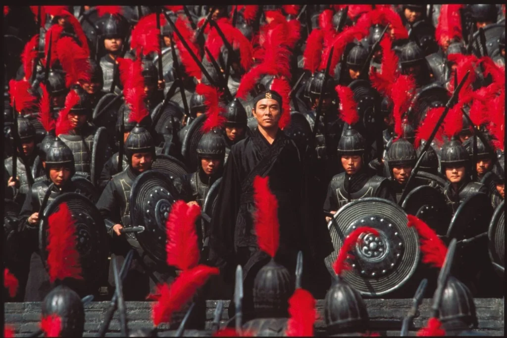 Jet Li in Zhang Yimou's Hero. Chinese warriors with red plumes and shields. Martial arts film.