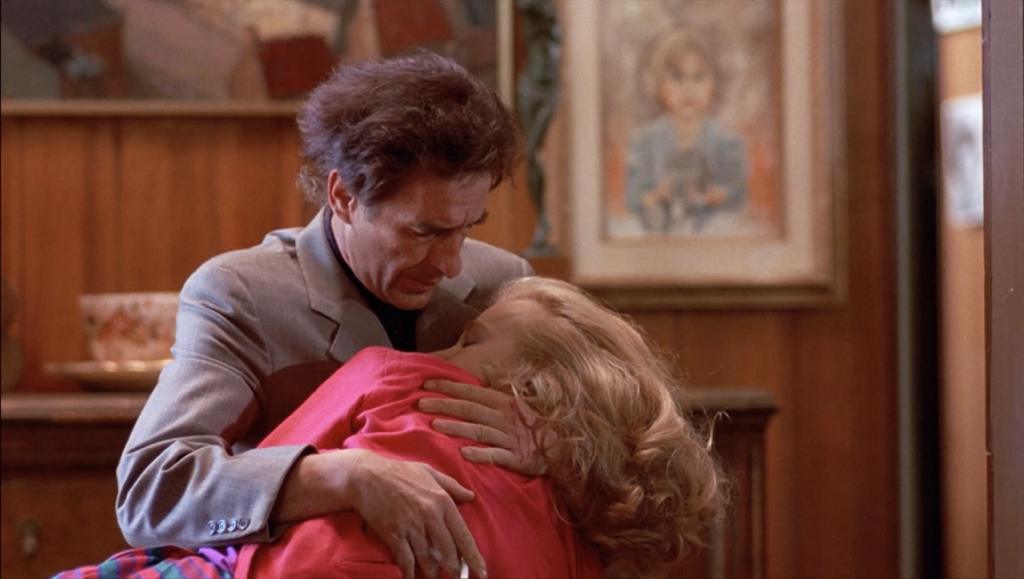 John Cassavetes' Love Streams scene. Man embracing a woman, emotional moment. Film still.