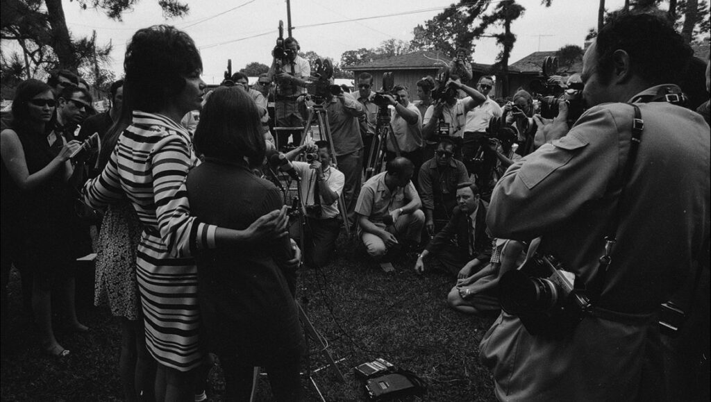 Apollo 13: Press surrounds family. Black and white photo of media covering the Apollo 13 mission. NASA history.