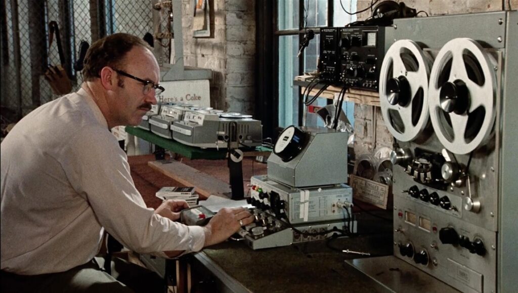 The Godfather Part II: Man operating vintage recording equipment. Francis Ford Coppola film scene.