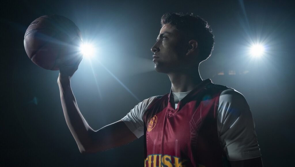 Rez Ball movie still. Young basketball player with ball. Sydney Freeland film review.