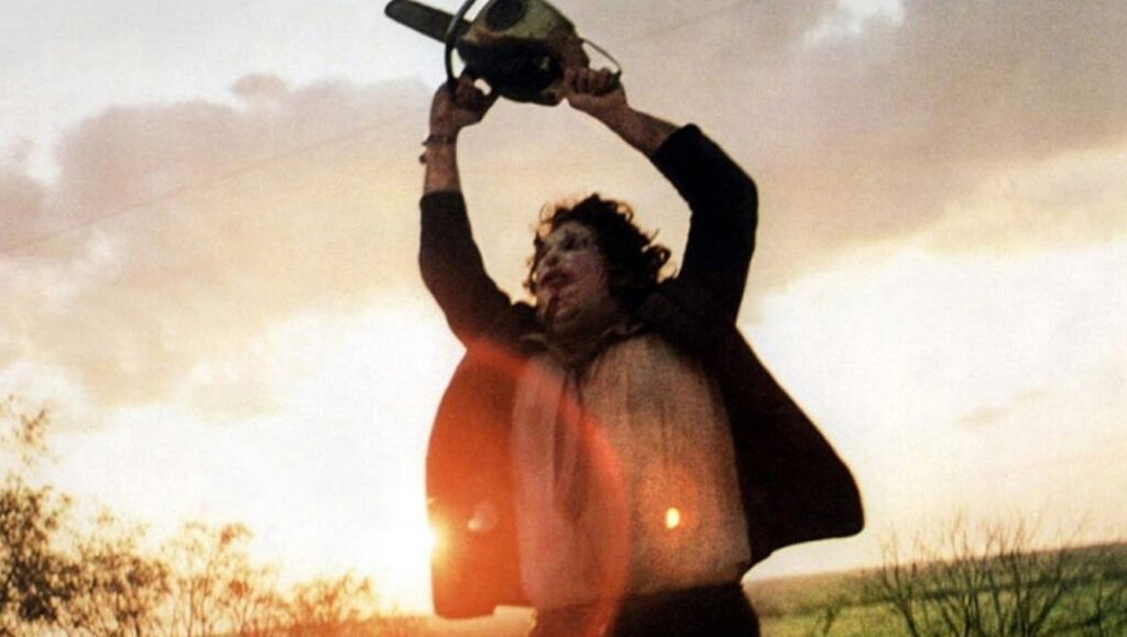 Leatherface wielding chainsaw in Texas Chain Saw Massacre. Horror movie icon celebrating 50 years of terror.
