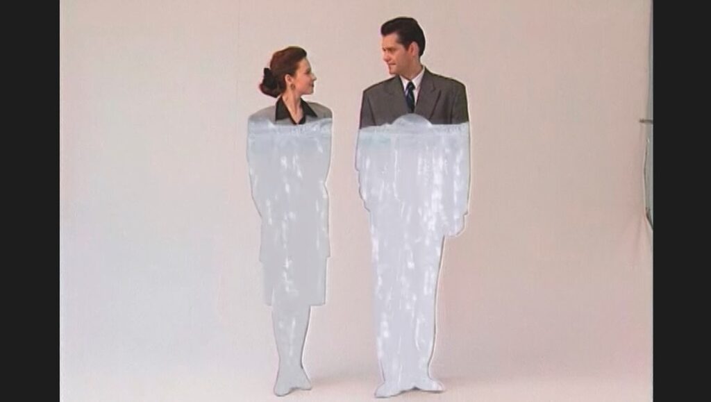 Eight Postcards from Utopia film still: Cutout figures of a man and woman in formal attire. Radu Jude film review.