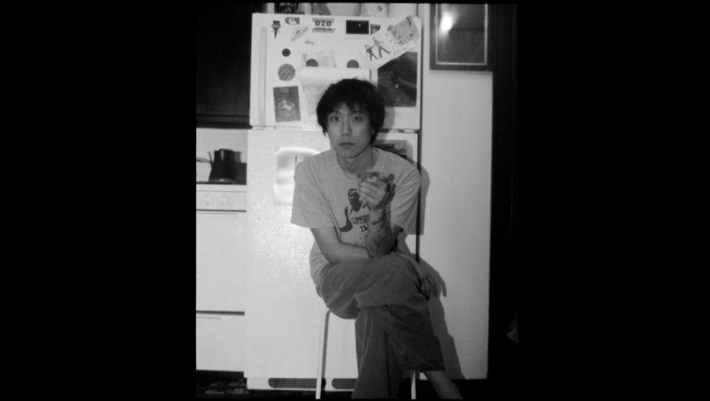 Jinho Myung, independent filmmaker, in black and white. Interview with the director. Portrait of a young filmmaker.
