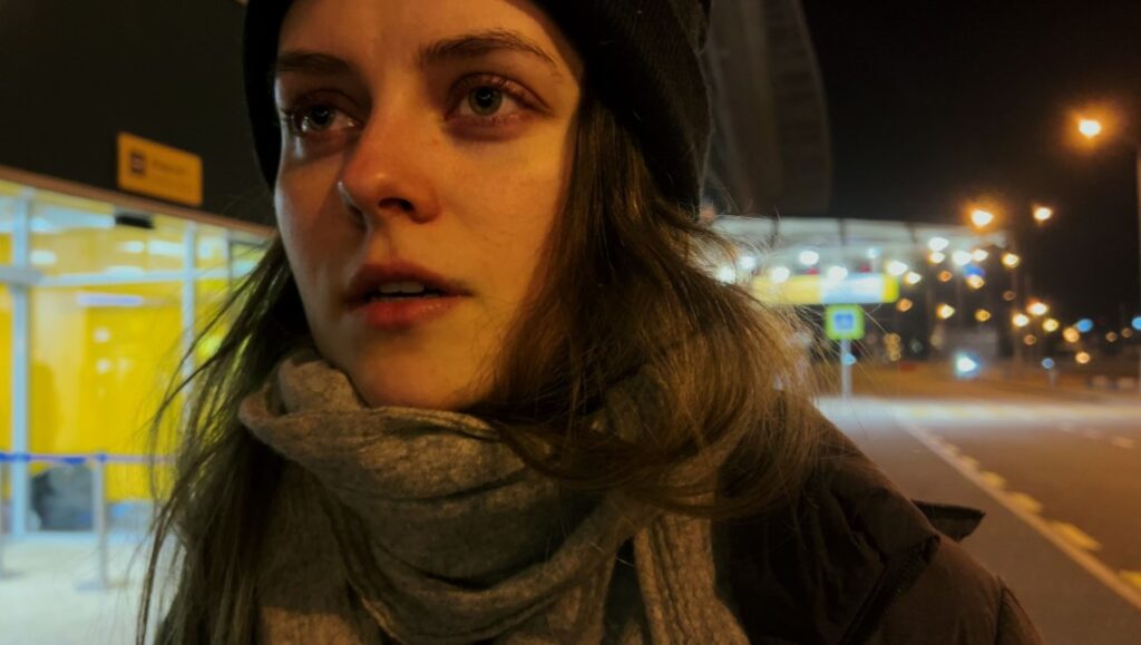 My Undesirable Friends: Last Air in Moscow film still. Woman in scarf, night scene. NYFF '24 review.