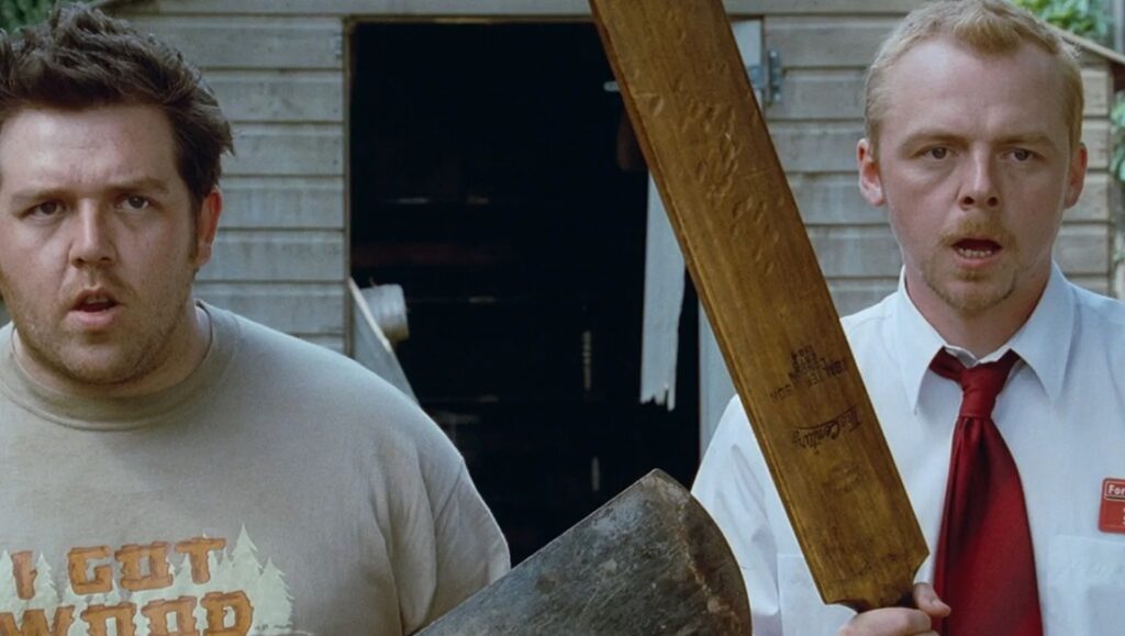 Shaun of the Dead movie still: Nick Frost and Simon Pegg with cricket bat and axe.