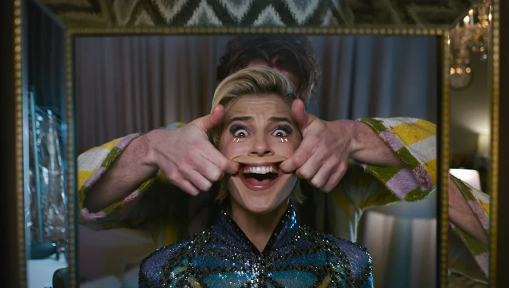 Smile 2 movie scene. Woman's face distorted into a forced smile, horror movie imagery.