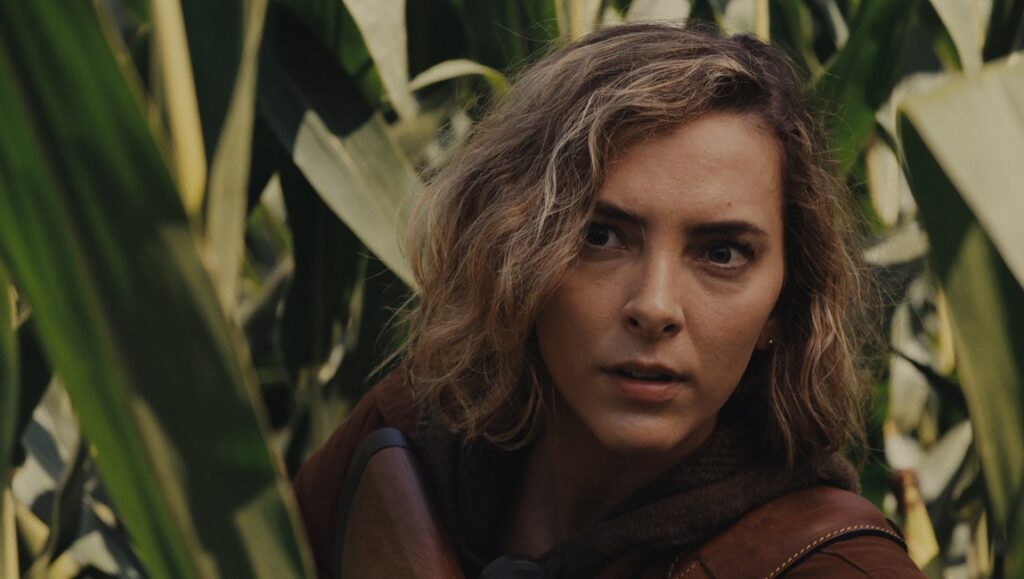 Things Will Be Different review: Woman in a cornfield looking concerned.