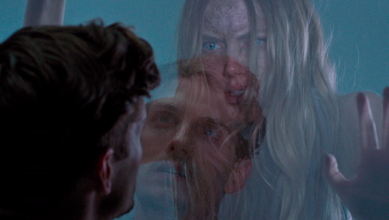 The Fix review: Kelsey Egan film scene with a woman's face and a man's face layered on top of each other.