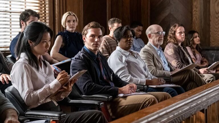 A diverse jury sits attentively in a courtroom setting, reviewing evidence. Light Matter '24 review.