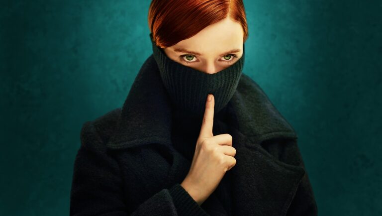 Say Nothing on Hulu. Woman with finger to lips, wearing a black turtleneck. Suspenseful TV show.
