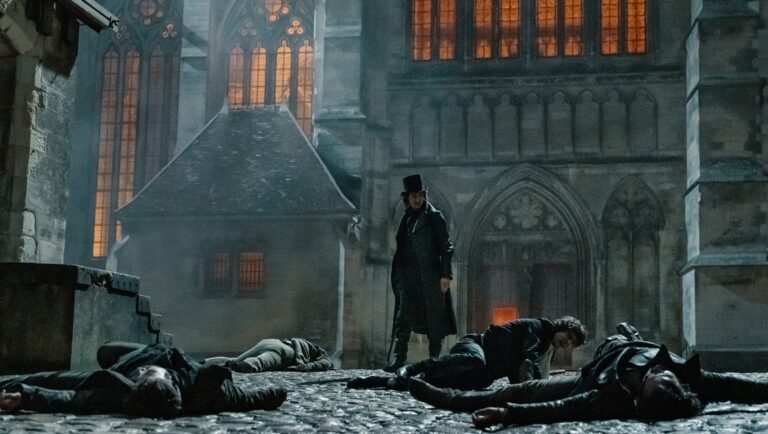 The Count of Monte Cristo movie scene. Man in top hat stands over bodies in a courtyard.