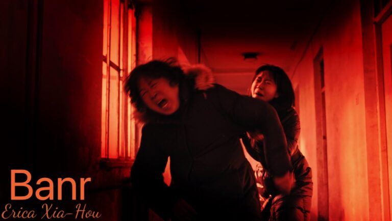 Banr movie scene. Two distressed Asian women in a red-lit corridor. Horror film.