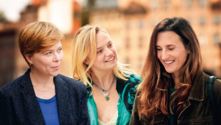 Three smiling women friends. Group of diverse women, friendship, and togetherness.