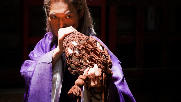 IFFR 2025 — Dispatch 2: Blazing Fists, Guo Ran, Bad Girl NYAFF 2025 film still: Man in purple robe holds woven object to face. Lilim, Bel Ami, A Girl with Closed Eyes.