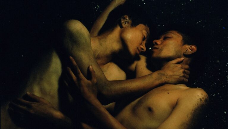 Two shirtless men embrace intimately. Sensual, romantic, and artistic. LGBT love concept.