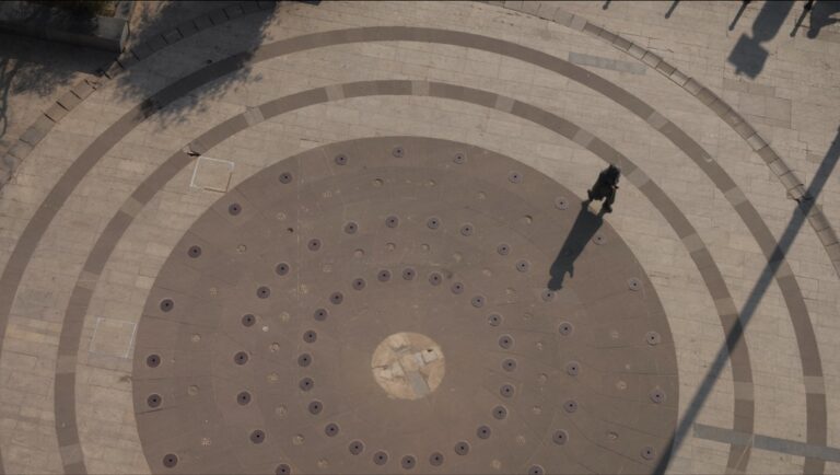Cinéma du Réel 2025 film still: Aerial view of person walking on circular patterned ground. Documentary evidence.