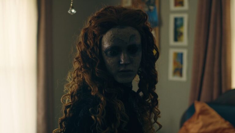 825 Forest Road movie still. Scary woman with pale face and red curly hair. Horror film scene.