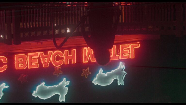 No Sleep Till film still. Neon sign with rabbit and star shapes. New Directors/New Films 2025.