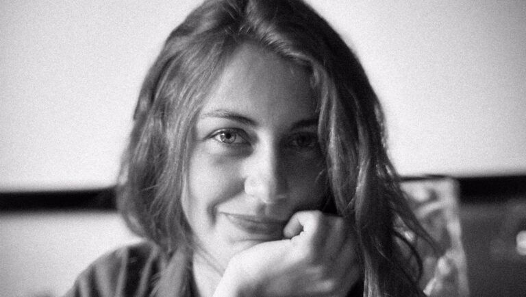 Alexandra Simpson headshot by Caveh Zahedi. Black and white portrait of the author with hand on chin.