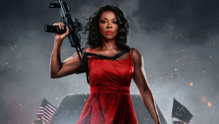 Viola Davis in G20. Actress holding gun, wearing red dress. Amazon MGM Studios film. Action movie.