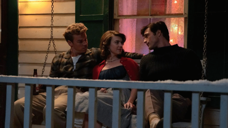 Swift Horses movie scene: Jacob Elordi, Will Poulter, and a woman on a porch swing. Festive lights in the background.