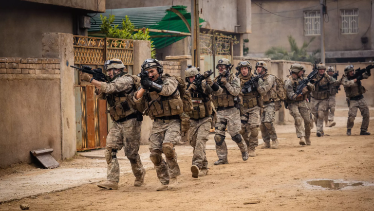 Soldiers in combat gear with rifles, Warfare movie scene.